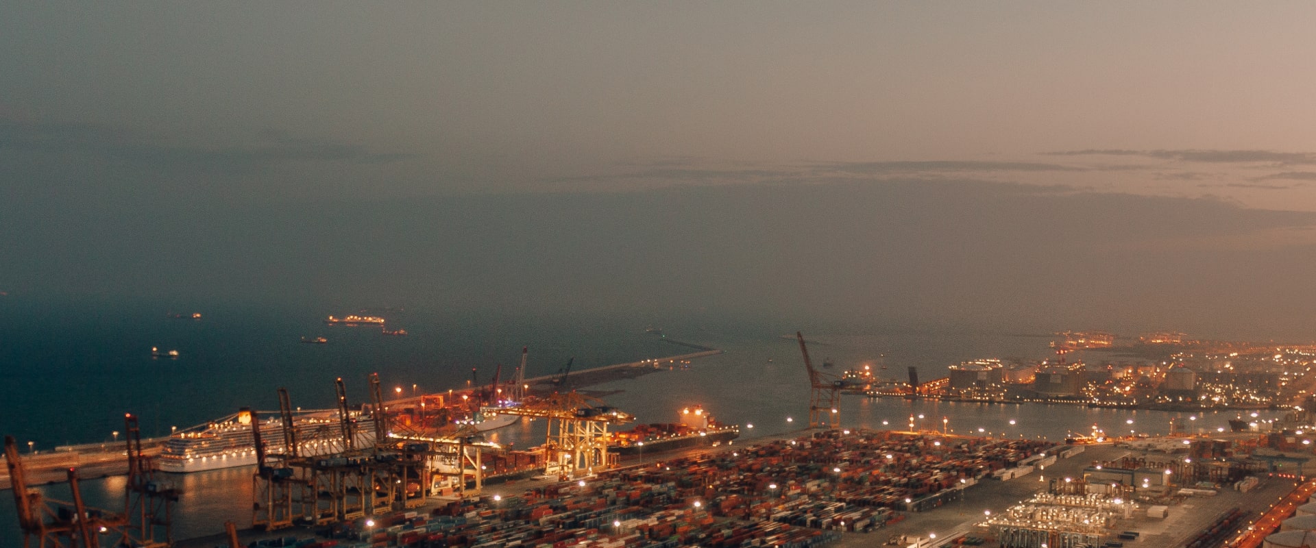 Port cranes at sunset